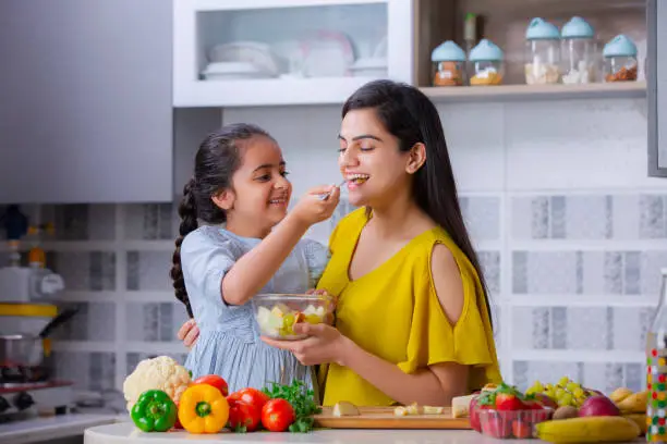 Parent preparing a healthy meal with children